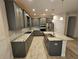 Modern kitchen with gray cabinets, granite countertops, and stainless steel appliances at 16320 Hyde Manor Dr, Tampa, FL 33647
