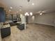 Modern kitchen with gray cabinets, granite counters, and stainless steel appliances at 16320 Hyde Manor Dr, Tampa, FL 33647