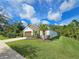 House exterior showcasing landscaping and garage at 16320 Hyde Manor Dr, Tampa, FL 33647