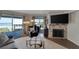 Comfortable living room with ocean view, fireplace and seating at 17980 Gulf Blvd # 205, Redington Shores, FL 33708