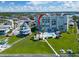 Aerial view of condo building with pool and waterfront at 17980 Gulf Blvd # 205, Redington Shores, FL 33708