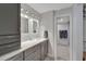 Modern bathroom with double vanity, granite countertop and a separate shower at 17980 Gulf Blvd # 205, Redington Shores, FL 33708