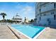 Inviting rectangular swimming pool with lounge chairs at 17980 Gulf Blvd # 205, Redington Shores, FL 33708