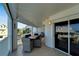 Spacious balcony with ocean view, outdoor dining set and lounge chairs at 17980 Gulf Blvd # 205, Redington Shores, FL 33708
