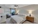 Bright bedroom with a king-size bed, balcony access, and plenty of natural light at 17980 Gulf Blvd # 205, Redington Shores, FL 33708