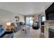 Spacious living room with ocean view, fireplace and ample seating at 17980 Gulf Blvd # 205, Redington Shores, FL 33708