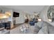 Living room with fireplace, comfortable seating, and ocean view at 17980 Gulf Blvd # 205, Redington Shores, FL 33708