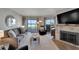 Relaxing living room with ocean view, fireplace and comfortable seating at 17980 Gulf Blvd # 205, Redington Shores, FL 33708
