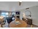 Ocean view dining area with wood table and chairs, near living room at 17980 Gulf Blvd # 205, Redington Shores, FL 33708