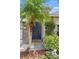 Dark blue front door with stone accents at 3001 Silvermill Loop, Land O Lakes, FL 34638