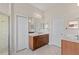 Spacious bathroom with double sinks, a large mirror, and a walk-in shower at 3001 Silvermill Loop, Land O Lakes, FL 34638