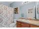 Clean bathroom with a single sink vanity, shower/tub combo at 3001 Silvermill Loop, Land O Lakes, FL 34638