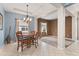 Bright dining area with a four-person table and chandelier at 3001 Silvermill Loop, Land O Lakes, FL 34638