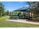 Covered playground with bike rack nearby at 3001 Silvermill Loop, Land O Lakes, FL 34638