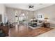 Living room with hardwood floors, sliding doors to backyard, and comfortable seating at 3001 Silvermill Loop, Land O Lakes, FL 34638