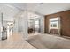 Open concept living and dining area with neutral colors at 3001 Silvermill Loop, Land O Lakes, FL 34638