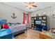 Charming bedroom with twin bed, built-in shelving, and a window at 3001 Silvermill Loop, Land O Lakes, FL 34638