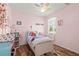 Charming bedroom with a twin bed, plenty of storage, and a window at 3001 Silvermill Loop, Land O Lakes, FL 34638