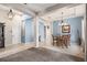 Open dining room with light blue walls and chandelier at 3001 Silvermill Loop, Land O Lakes, FL 34638