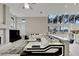 Spacious living room featuring a large sectional sofa and a fireplace at 10301 Manta Way, Tampa, FL 33615