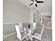 Modern dining room featuring a glass table and white chairs at 10301 Manta Way, Tampa, FL 33615