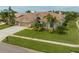 Beautiful two-story home with tile roof and landscaped lawn at 10301 Manta Way, Tampa, FL 33615