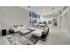 Open concept kitchen and living area with modern appliances and stylish furniture at 10301 Manta Way, Tampa, FL 33615