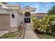 Elegant entryway with double doors and walkway at 10301 Manta Way, Tampa, FL 33615