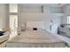 Main bedroom with a king-size bed and a crib at 10301 Manta Way, Tampa, FL 33615