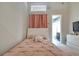 Bedroom with a queen-size bed and a view of the bathroom at 10301 Manta Way, Tampa, FL 33615