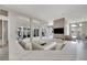Spacious living room with high ceilings and a large TV at 10301 Manta Way, Tampa, FL 33615