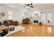 Living room showcasing hardwood floors, fireplace, natural light, and open layout at 2839 Bayshore Trails Dr, Tampa, FL 33611