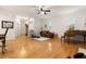 Open-concept living room featuring hardwood floors, natural light, and neutral color palette at 2839 Bayshore Trails Dr, Tampa, FL 33611