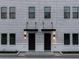 Elegant townhome entrances with sleek black doors and modern lighting at 1218 E Kay St # 11, Tampa, FL 33602