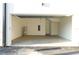 Spacious garage with exposed ceiling and door to in-law suite at 1218 E Kay St # 21, Tampa, FL 33602