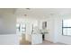 Bright kitchen with stainless steel appliances, range hood, and modern countertops at 1218 E Kay St # 21, Tampa, FL 33602