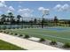 Outdoor basketball court at community featuring green surface, blue accents, and well maintained landscaping at 7002 162Nd E Pl, Parrish, FL 34219