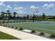 Outdoor basketball court featuring a modern backboard, new surface and green surroundings at 7002 162Nd E Pl, Parrish, FL 34219