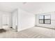 Upstairs bedroom with neutral carpet, bright white walls and a view of a window at 7002 162Nd E Pl, Parrish, FL 34219