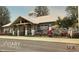 Community clubhouse exterior with modern architecture, lush landscaping, and well maintained grounds at 7002 162Nd E Pl, Parrish, FL 34219
