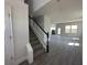 Bright entryway featuring a staircase with white railing at 7002 162Nd E Pl, Parrish, FL 34219