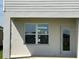 Covered patio with door and window on a light colored house at 7002 162Nd E Pl, Parrish, FL 34219