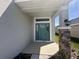 Inviting entrance with stylish front door and stone-accented column at 7002 162Nd E Pl, Parrish, FL 34219