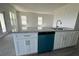 Island with granite countertops, modern sink, and white cabinetry at 7002 162Nd E Pl, Parrish, FL 34219