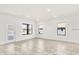 Open living room with tile floors, bright white walls and several windows at 7002 162Nd E Pl, Parrish, FL 34219