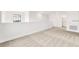 Open loft area with neutral carpet and view of a bathroom at 7002 162Nd E Pl, Parrish, FL 34219