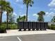 Community mailboxes on a sunny day with palm trees, landscaping and well maintained grounds at 7002 162Nd E Pl, Parrish, FL 34219