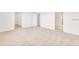 Spacious main bedroom with neutral carpet and views of the closet and bathroom at 7002 162Nd E Pl, Parrish, FL 34219