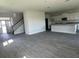 Bright open floor plan with modern kitchen and staircase at 7002 162Nd E Pl, Parrish, FL 34219