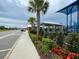 Playground with covered area, lush landscaping and decorative flowers at 7002 162Nd E Pl, Parrish, FL 34219